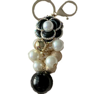 BLACK HEAVY ALLOY CAMILLA FLOWER W/RHINESTONES PEARL CENTER AND DANGLING…